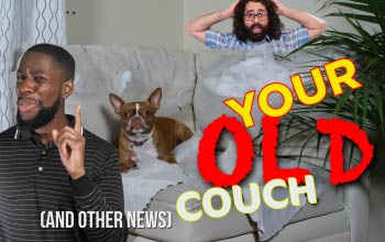 two men in front of and behind a couch with a dog on it